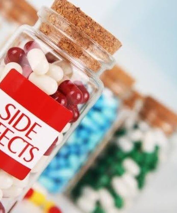 Bottle labeled side effects illustrating potential Orlistat side effects and treatment considerations.