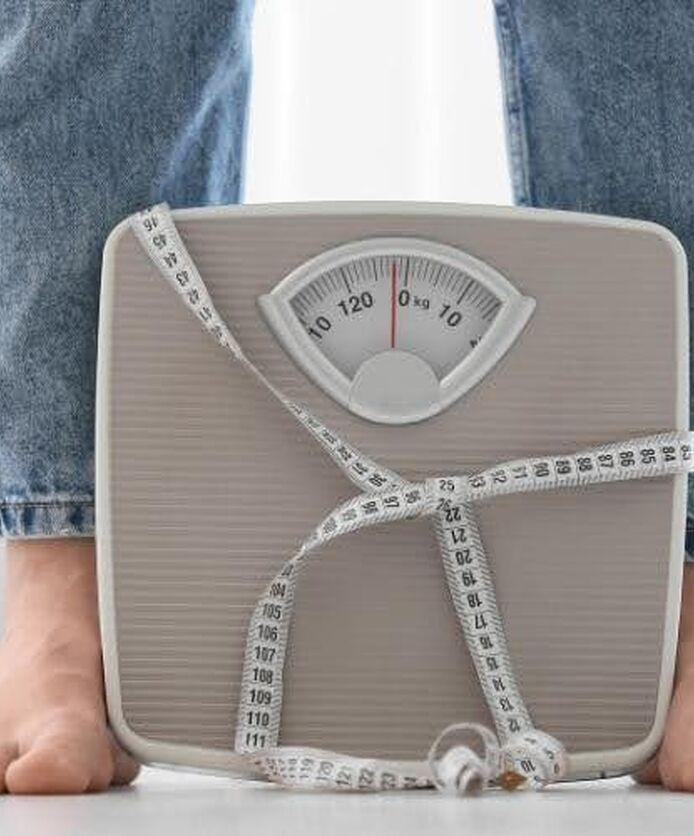 Weight loss tracking concept featuring a scale and measuring tape for monitoring Wegovy progress.