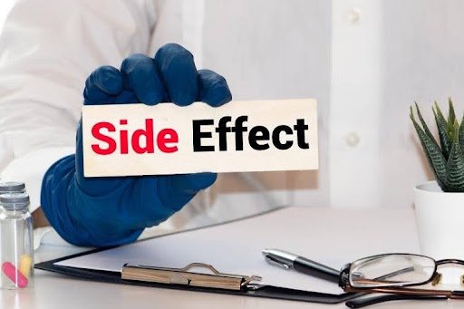 Doctor holding a sign about medication side effects.