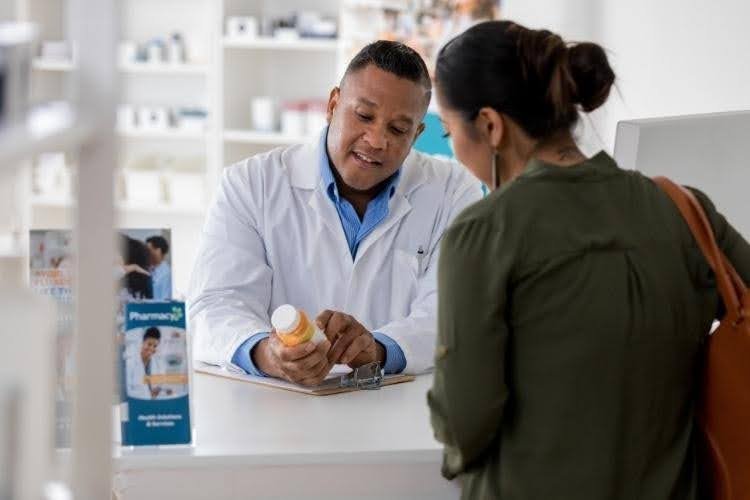 Medical consultation about managing Orlistat side effects and weight loss expectation.