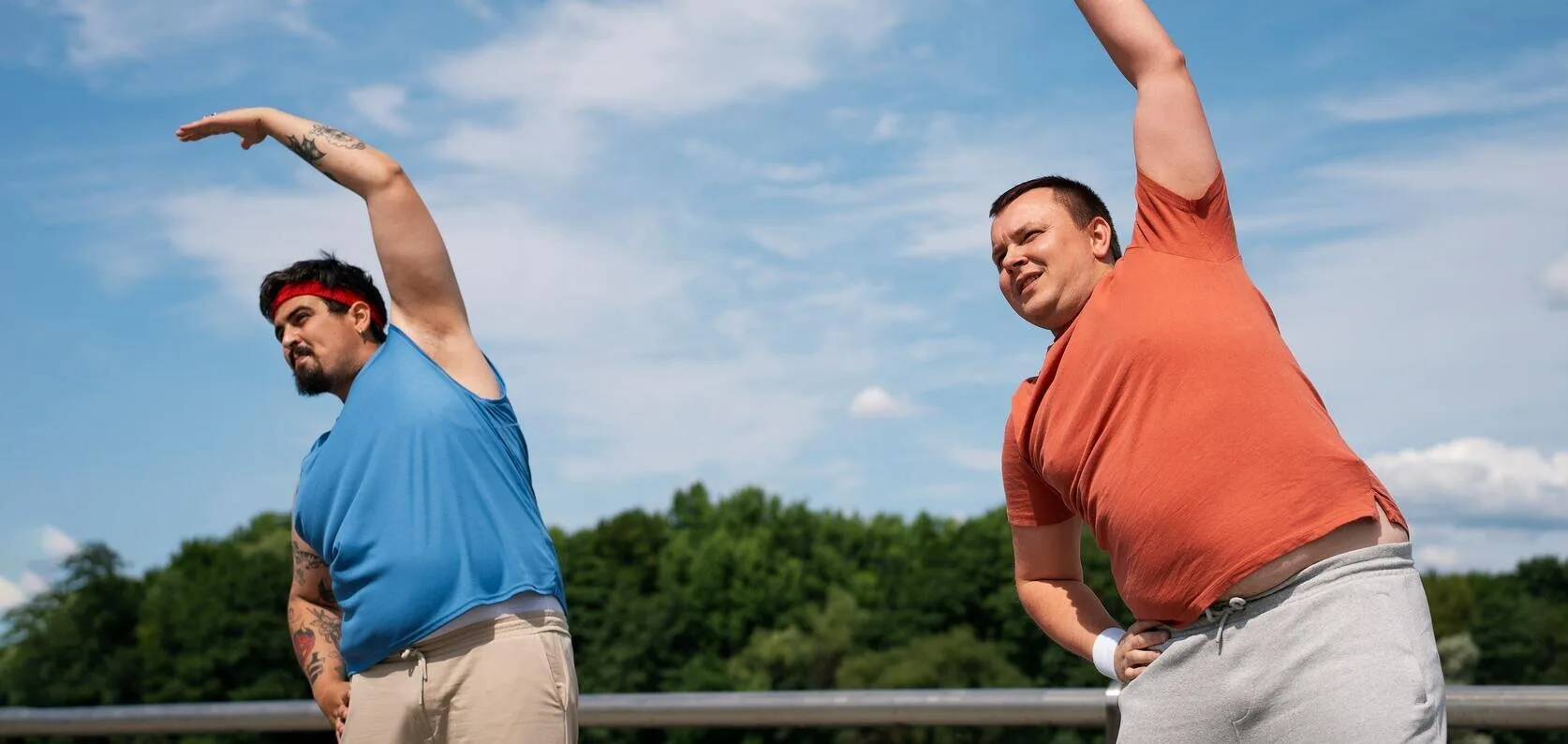 Two men stretching outdoors